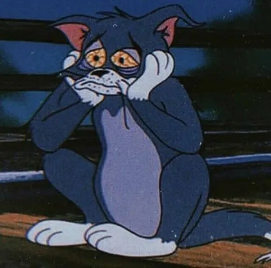 Hình ảnh mèo Tom u sầu, đôi vai run run ôm lấy nỗi nhớ.