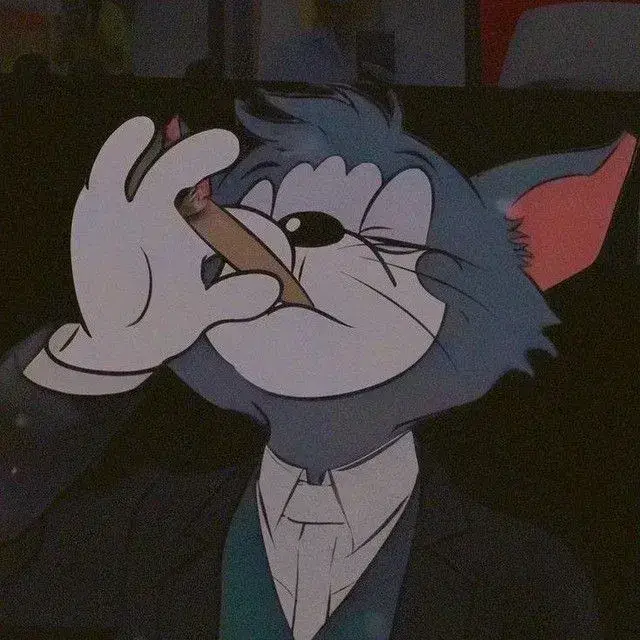 Mèo Tom mặc vest đen và cà vạt đỏ, biểu tượng quý ông hài hước